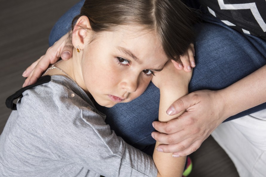 sad daughter hugging his mother