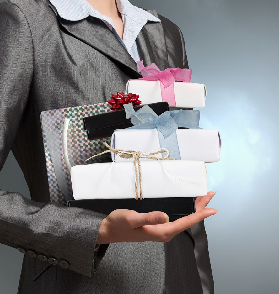 Businesswoman receiving or presenting gifts . Mixed media