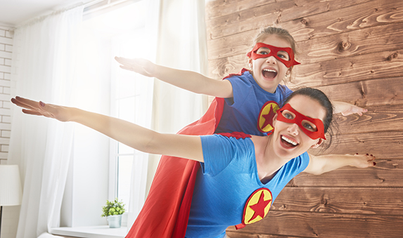 Girl and mom in Superhero costumes