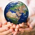 Family holding Earth planet