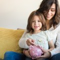 Mom and daughter saving money