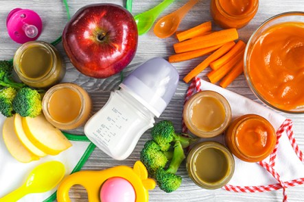 baby vegetable puree on wooden background top view