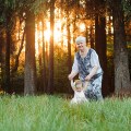 Grandmother and granddaughter walk in the park