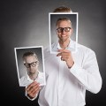 Man Holding Happy Picture In Front Of His Face