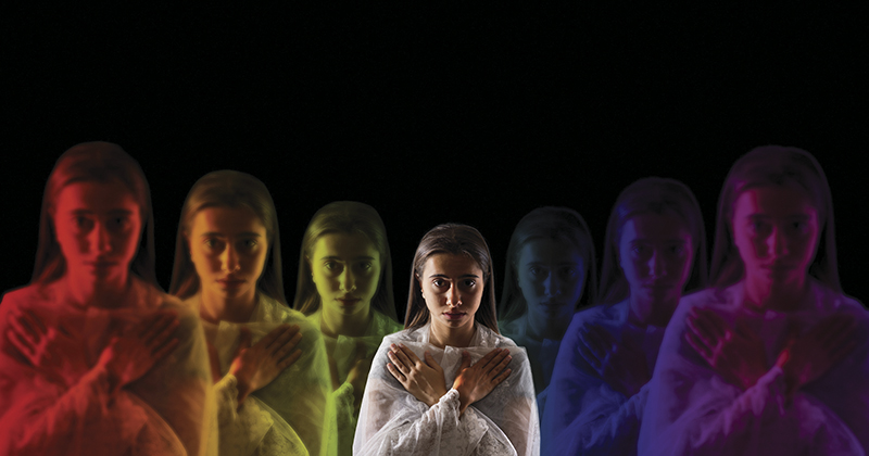 young girl meditating with aura colors