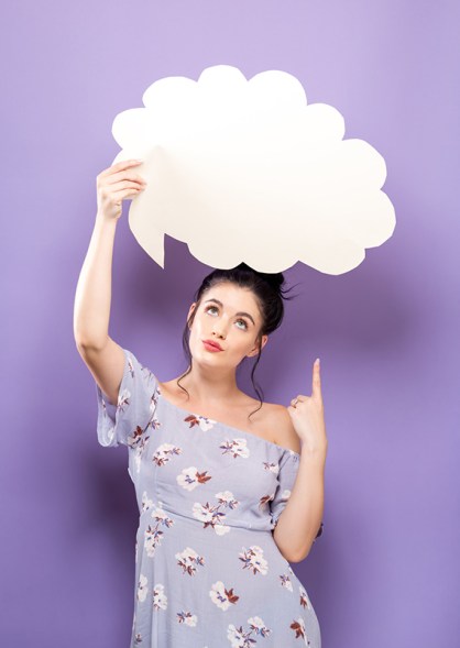 Young woman holding a speech bubble