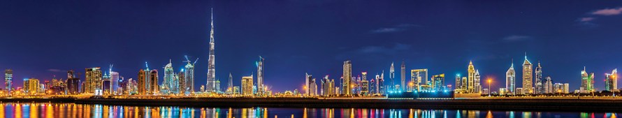 Night panorama of Dubai Downtown - the UAE