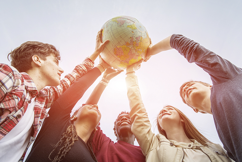 Multiracial Teen Couple Holding Globe Map - stock