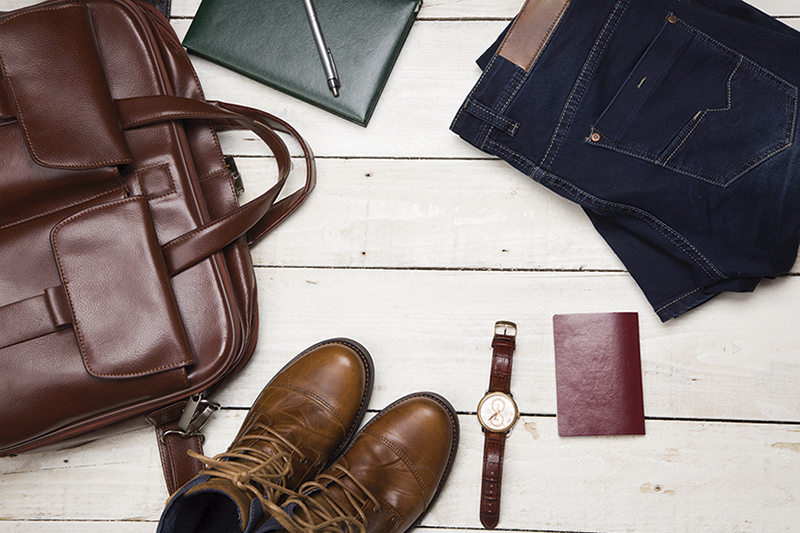 Men's casual outfits with leather accessories on white rustic wo