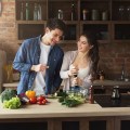 Happy couple cooking healthy food together