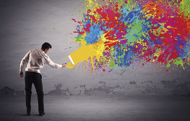 Sales person painting colorful splatter